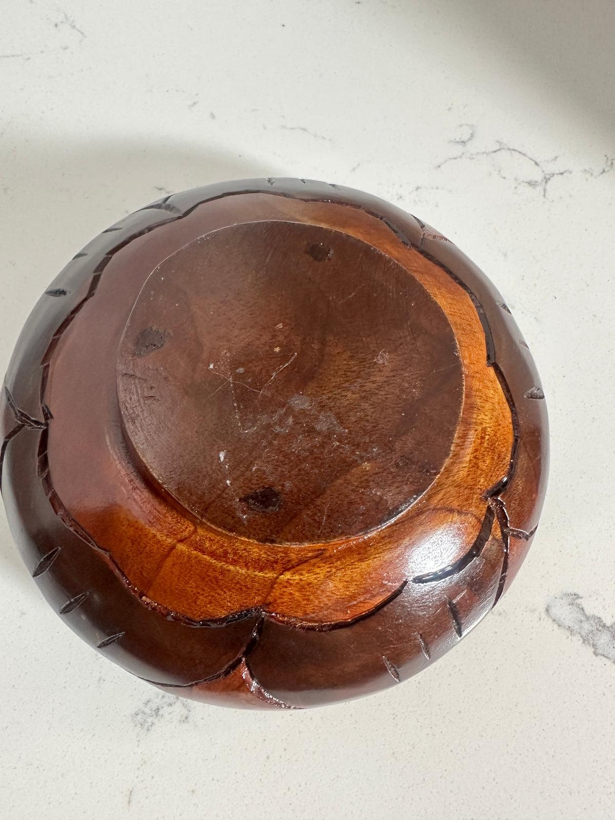 The Collected Chapter vintage 6-inch wood bowl with hand-carved leaf patterns on the exterior and a footed base.
