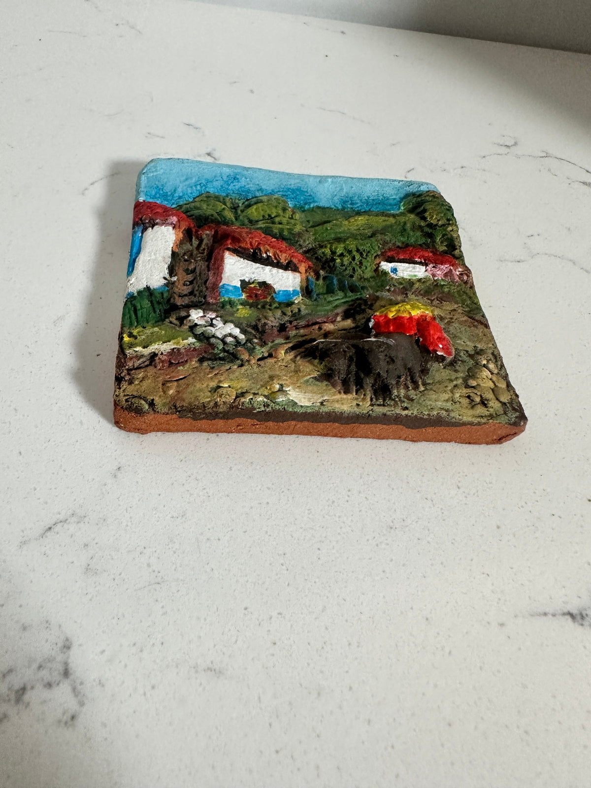 The Collected Chapter vintage Costa Rica ceramic relief wall plaque featuring a hand-painted 3D village scene.
