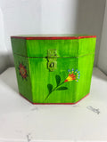 The Collected Chapter vintage octagonal wooden keepsake box in lime green with hand-painted folk art floral motifs.