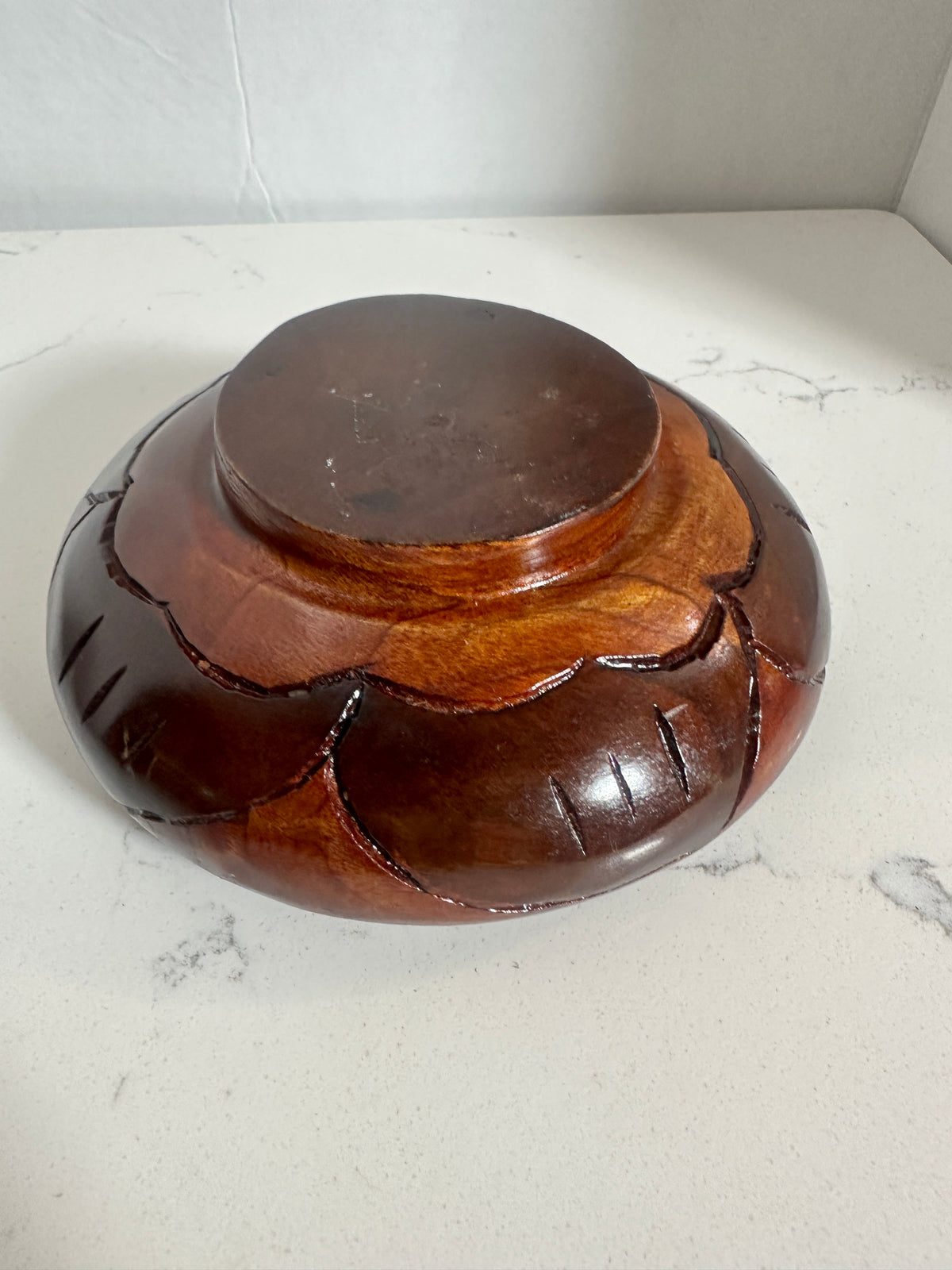 The Collected Chapter vintage 6-inch hand-carved wood bowl with a reddish-brown finish and floral leaf exterior design