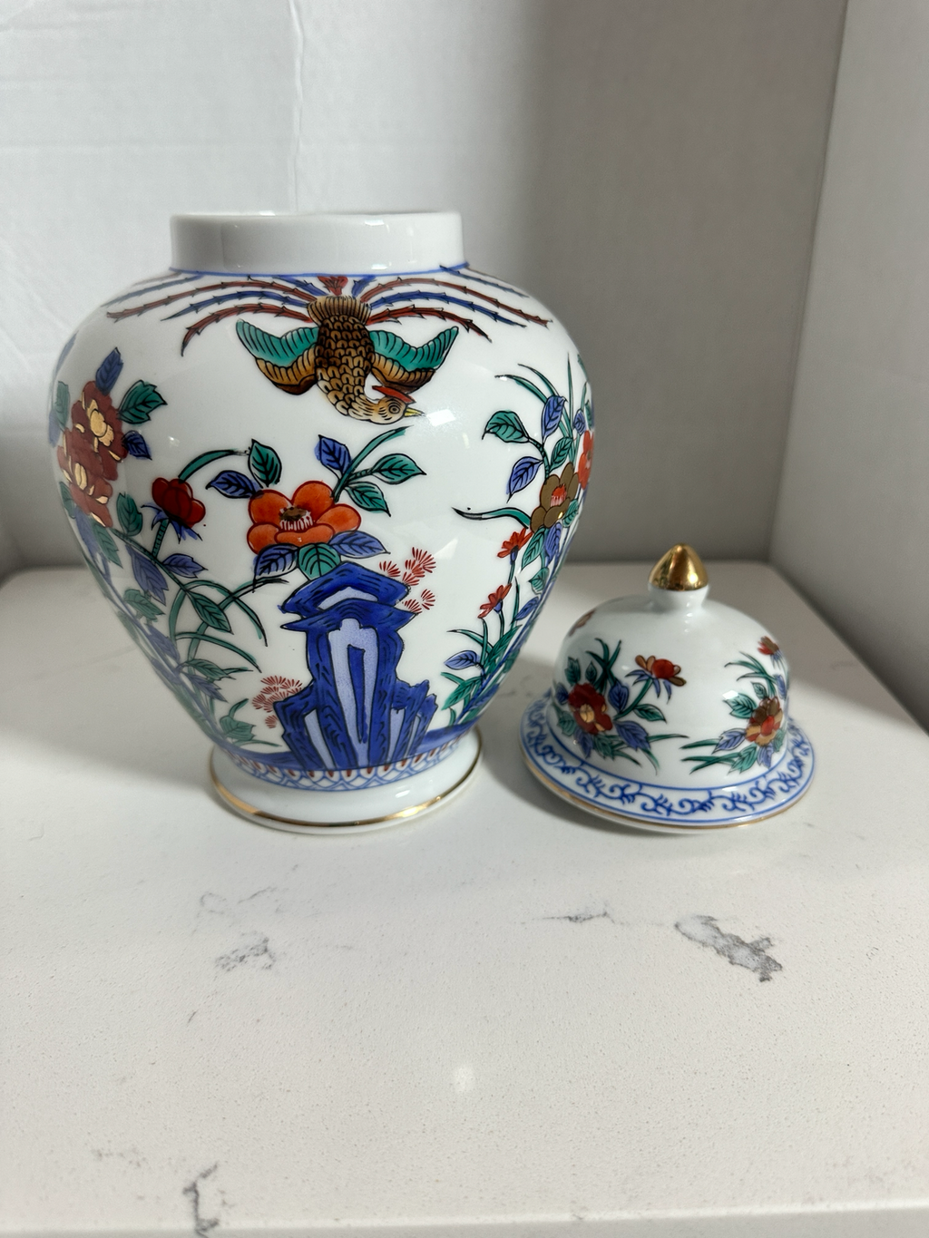 The Collected Chapter vintage Macau porcelain ginger jar with hand-painted phoenix, floral motifs, and gold accents.
