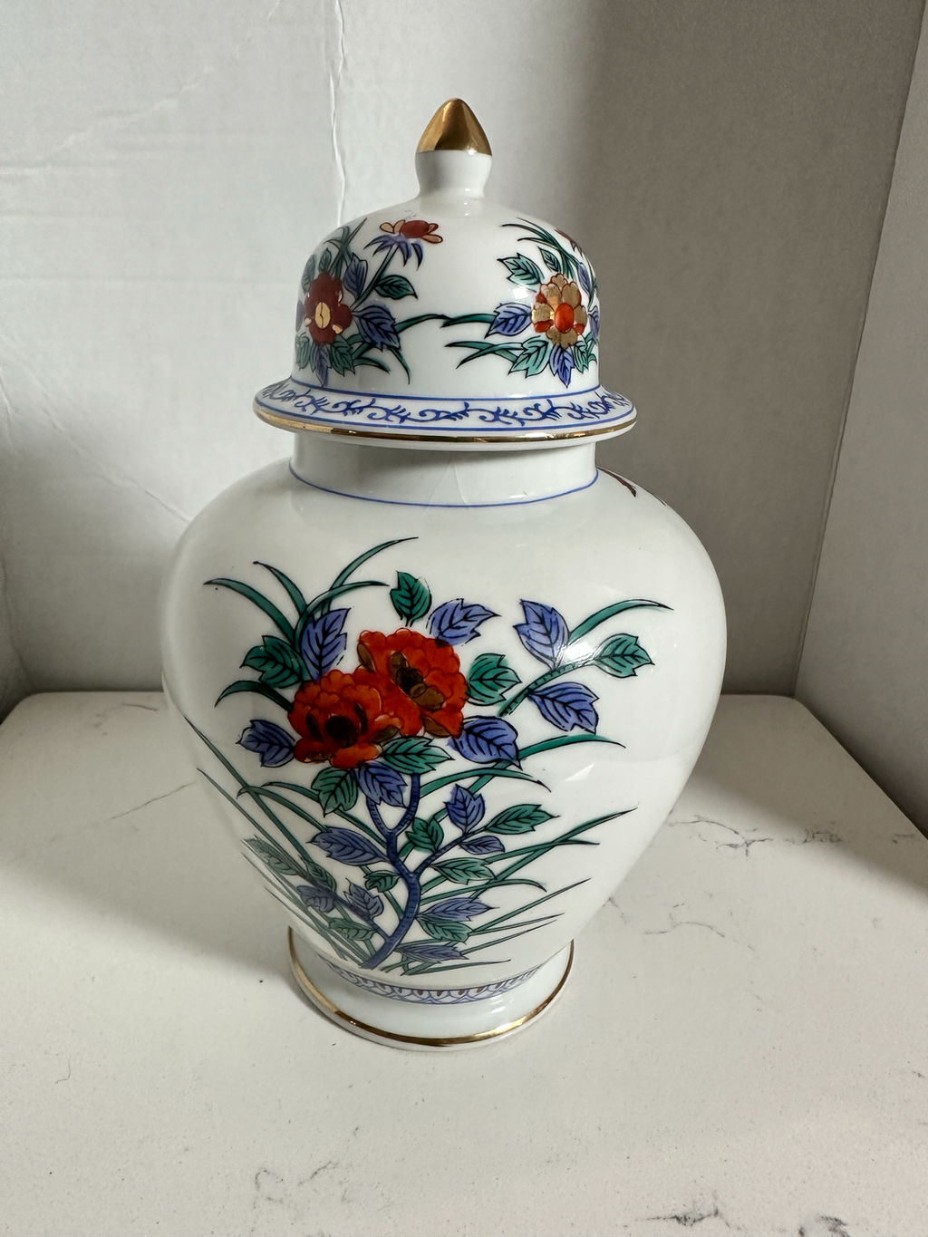 The Collected Chapter vintage Macau porcelain ginger jar with hand-painted floral phoenix motif and gold accents.