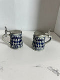 The Collected Chapter pair of vintage miniature ceramic beer steins with cobalt blue diamond patterns and metal lids.