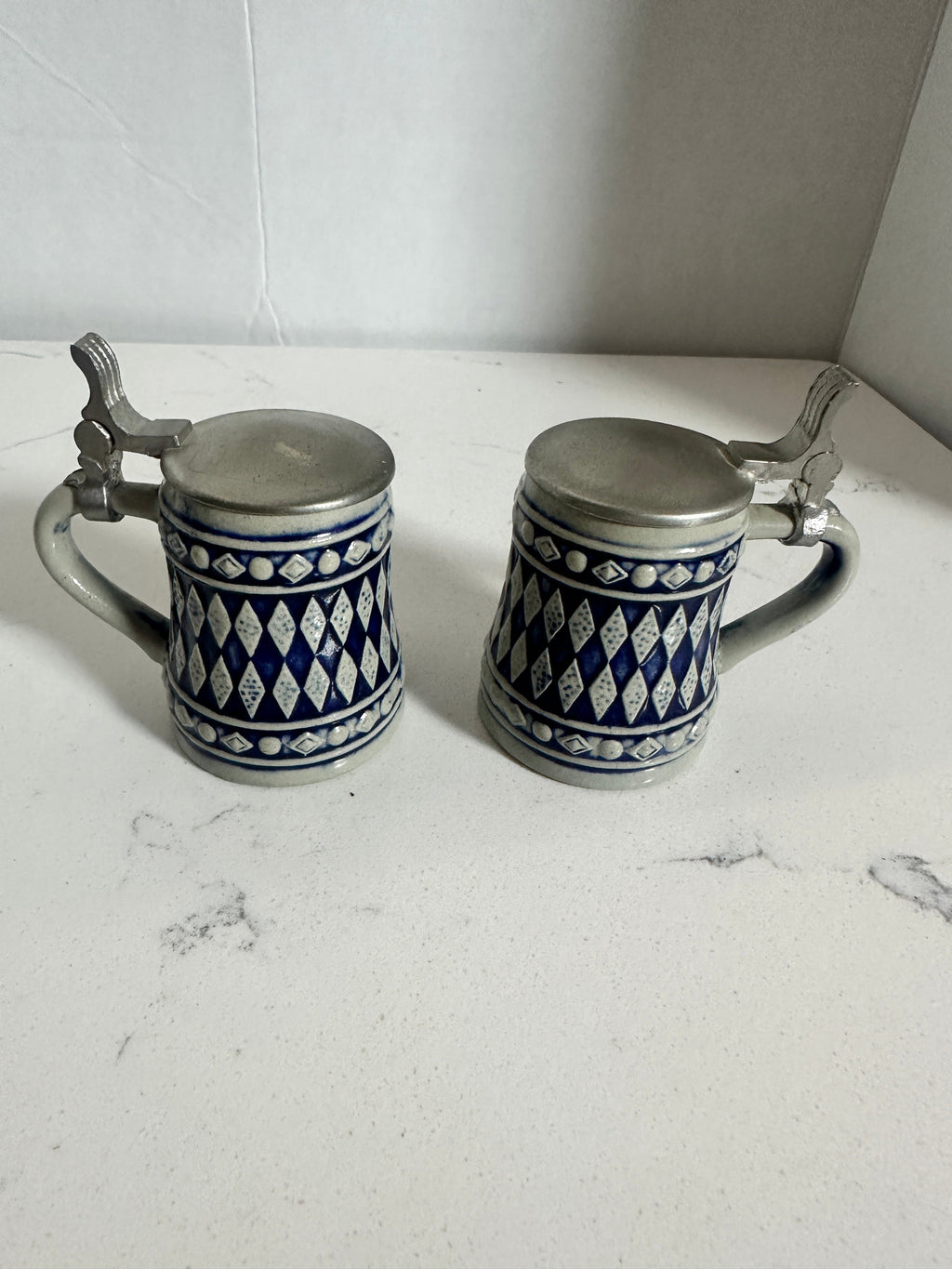The Collected Chapter pair of vintage miniature ceramic beer steins with cobalt blue and cream Bavarian diamond pattern