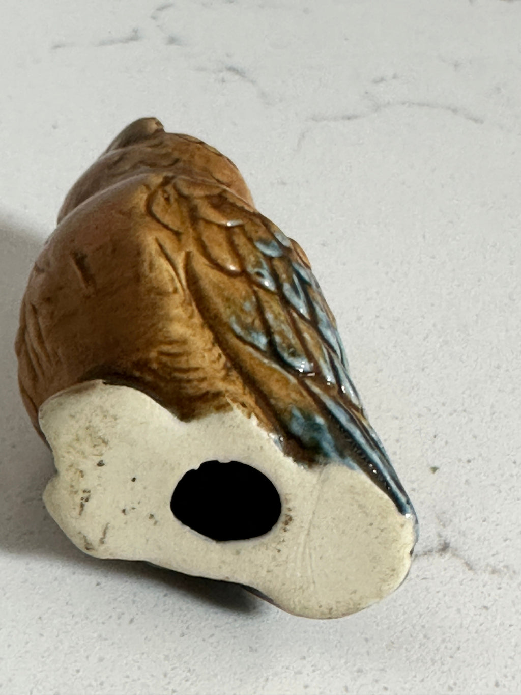 The Collected Chapter vintage miniature ceramic owl figurine showing the hollow base and detailed brown glazed feathers