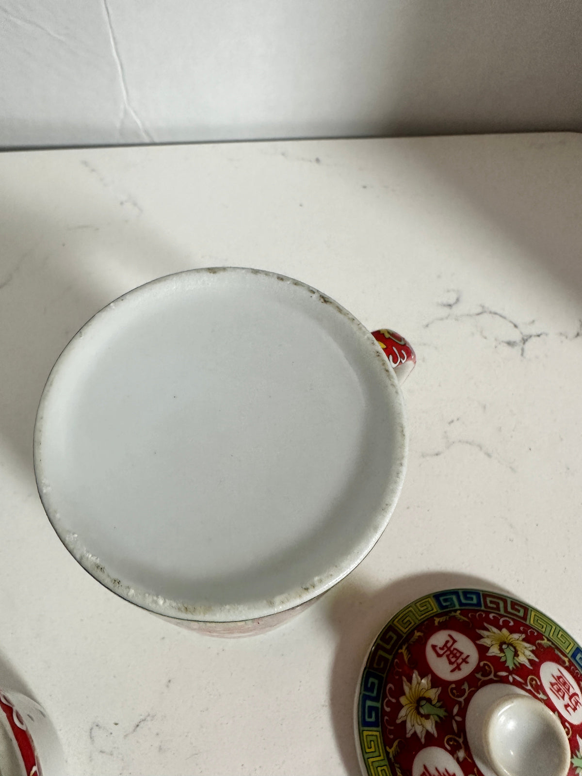The Collected Chapter vintage Chinese Mun Shou porcelain tea mug base showing age-related wear and matching lid