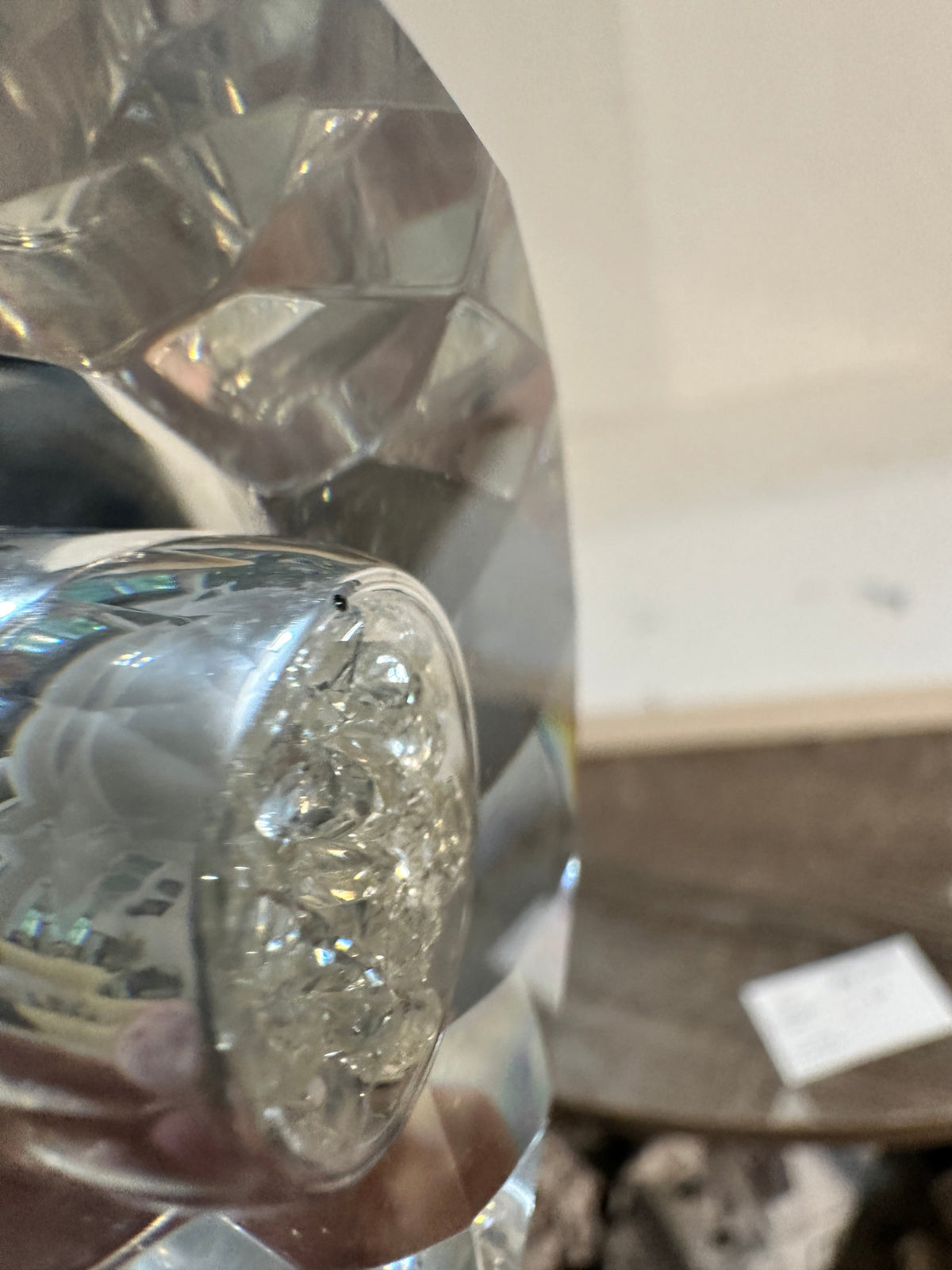 The Collected Chapter Oleg Cassini crystal pedestal bowl featuring a detailed crackle-style center and faceted edges.