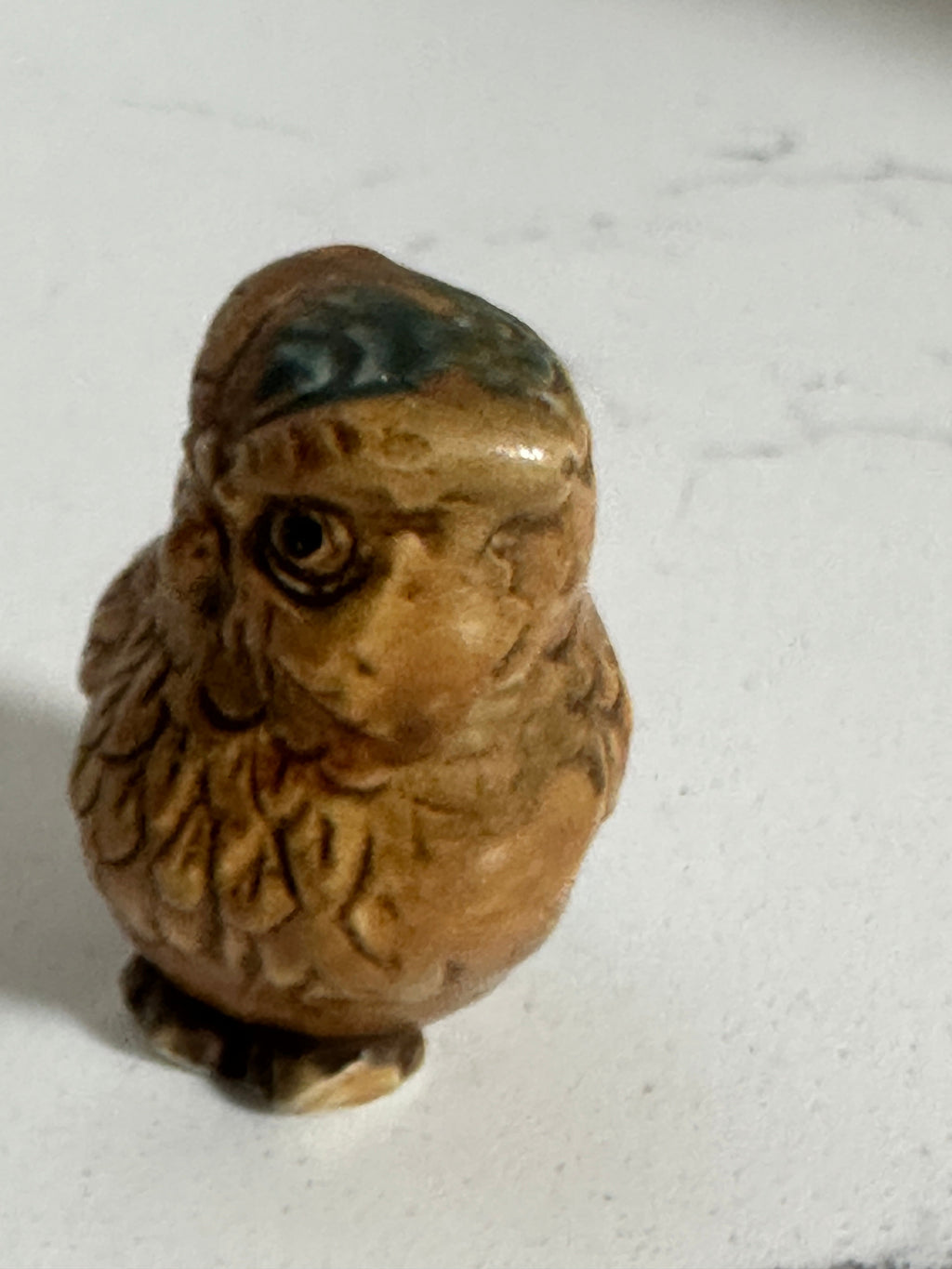 The Collected Chapter vintage 2-inch glazed ceramic owl figurine in brown with blue-green feather details.
