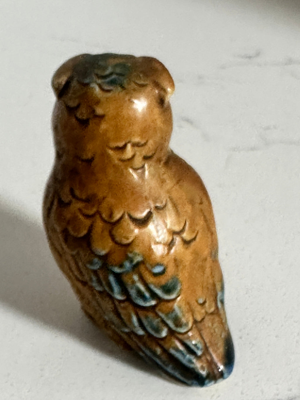 The Collected Chapter vintage 2-inch brown glazed ceramic owl figurine with molded feather details and blue-green hues.