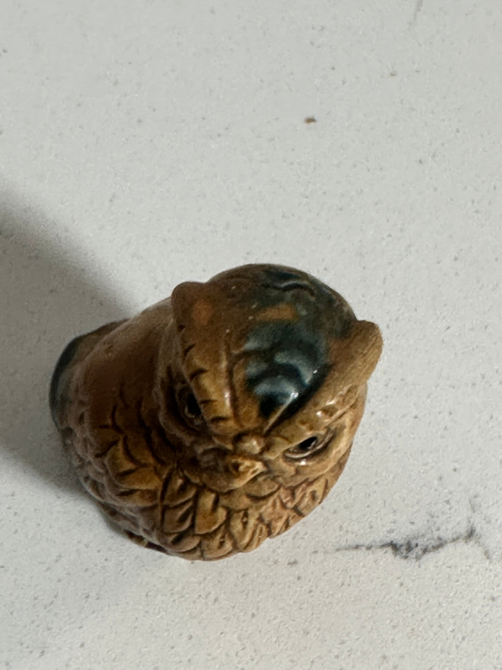 The Collected Chapter vintage miniature ceramic owl figurine in brown with blue-green accents and molded feather detail.