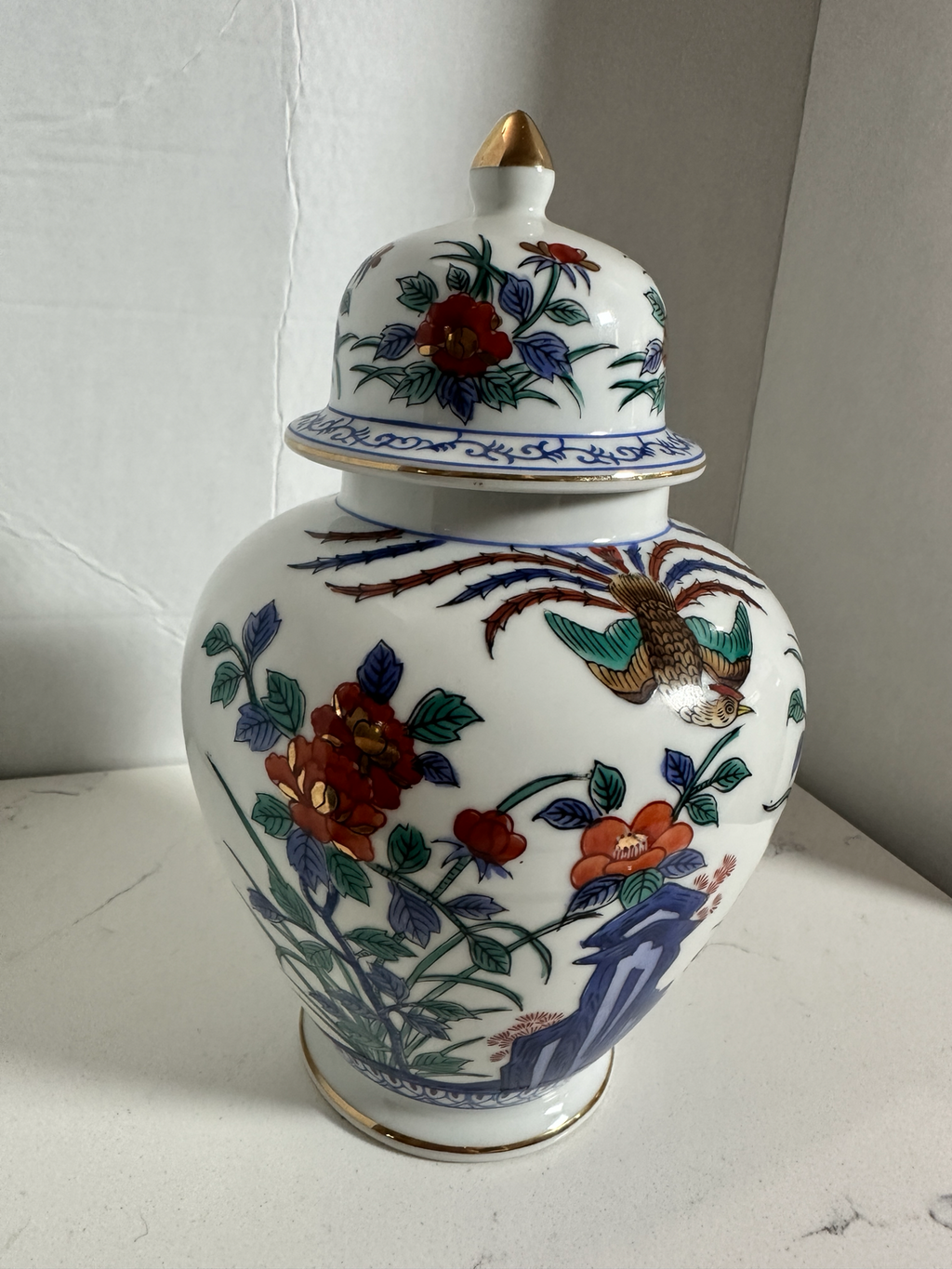 The Collected Chapter vintage Macau porcelain ginger jar with hand-painted phoenix, floral motifs, and gold accents.