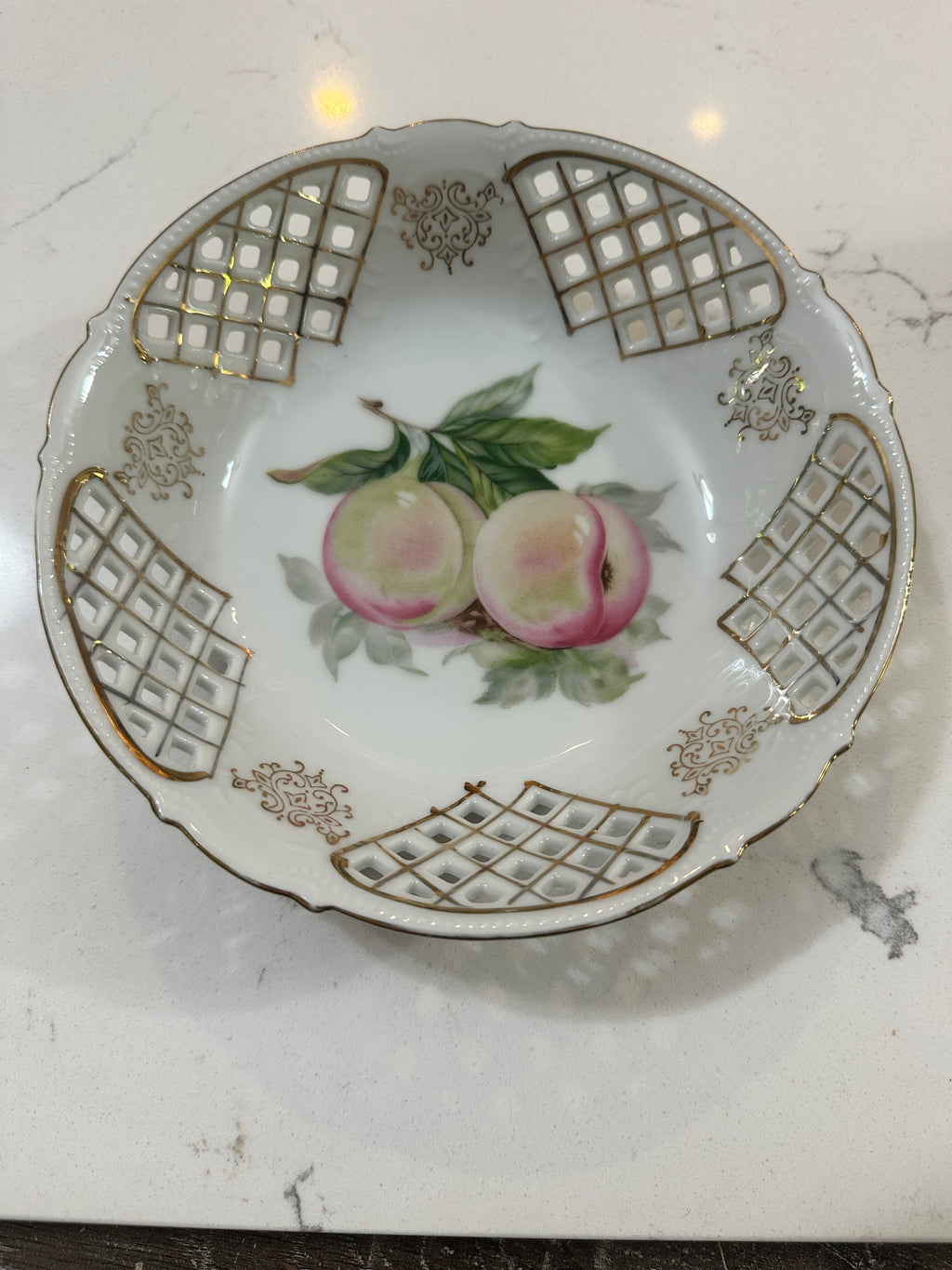 The Collected Chapter vintage UCAGCO China porcelain fruit bowl with peach motif, gold lattice, and scalloped edge.
