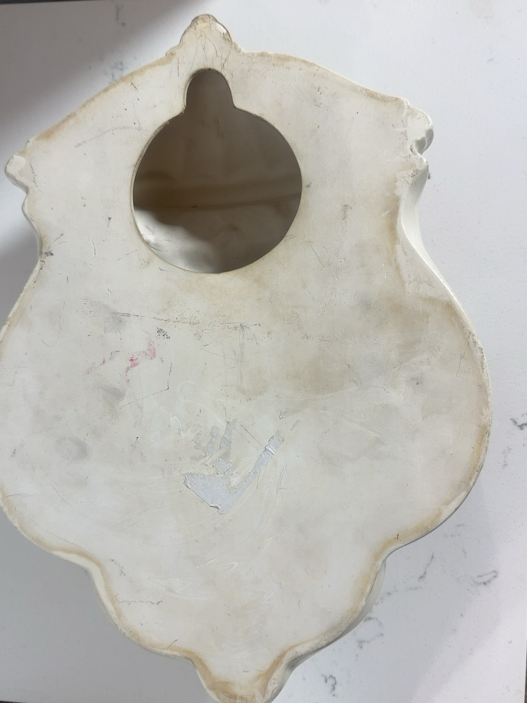 Back view of The Collected Chapter vintage resin wall-mounted grape dispenser showing mounting hole and cream finish