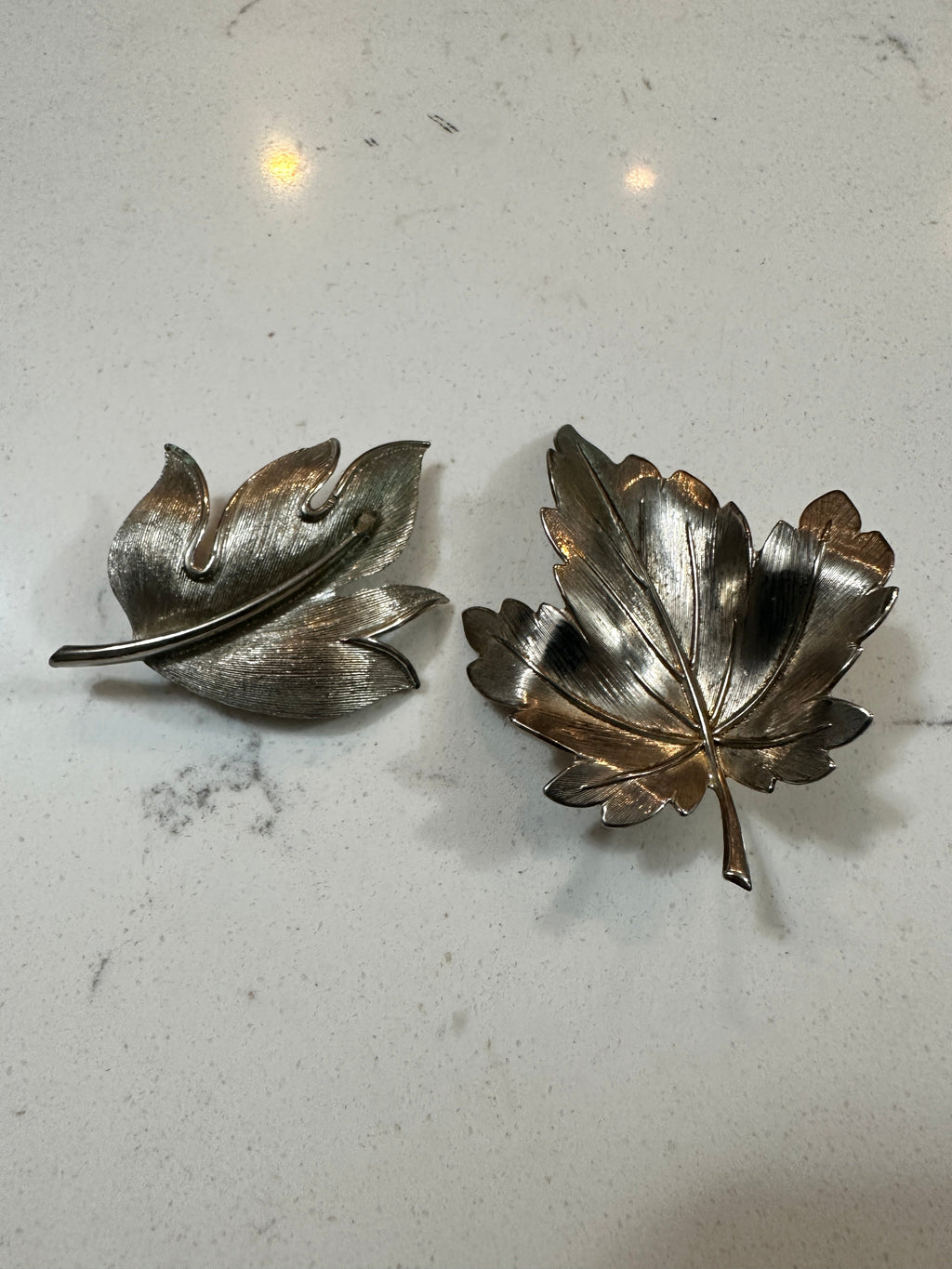 The Collected Chapter set of two vintage silver-tone leaf brooches with textured botanical details and pin-back closures
