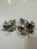 The Collected Chapter vintage silver-tone leaf brooch set featuring a large maple leaf and a smaller curved leaf pin.