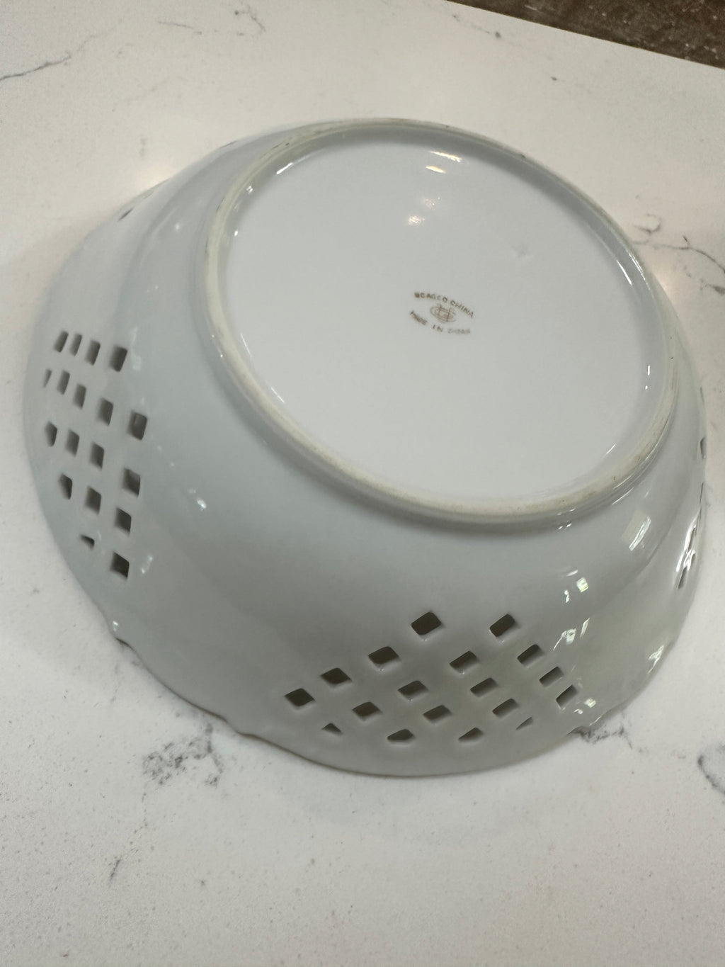 The Collected Chapter vintage UCAGCO China porcelain fruit bowl underside showing the maker mark and lattice detail